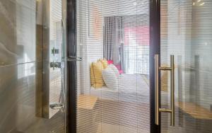 a glass door with a view of a room at Espina Hotel in Antalya