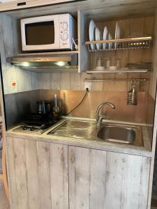 A kitchen or kitchenette at Arginonta Beach Apartments