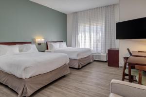 MySuites Lawton客房内的一张或多张床位