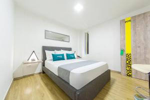 Postel nebo postele na pokoji v ubytování Ayenda Bee Hotel
