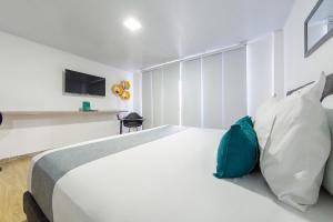 Voodi või voodid majutusasutuse Ayenda Bee Hotel toas