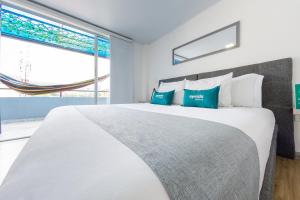 Voodi või voodid majutusasutuse Ayenda Bee Hotel toas