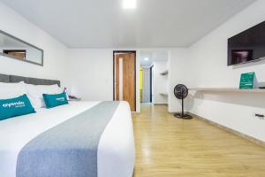 Voodi või voodid majutusasutuse Ayenda Bee Hotel toas