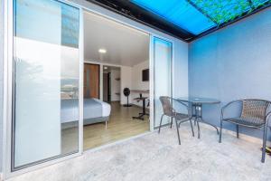 Voodi või voodid majutusasutuse Ayenda Bee Hotel toas