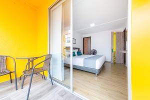 Voodi või voodid majutusasutuse Ayenda Bee Hotel toas