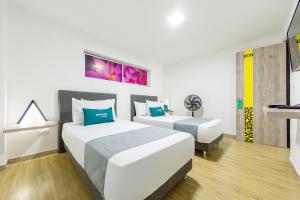 Voodi või voodid majutusasutuse Ayenda Bee Hotel toas