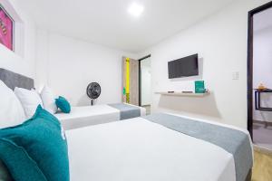Voodi või voodid majutusasutuse Ayenda Bee Hotel toas