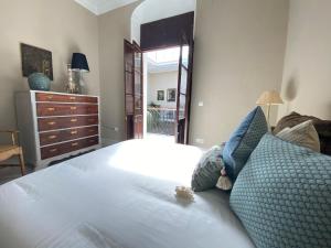 Postel nebo postele na pokoji v ubytování Casa Palacio Ánima