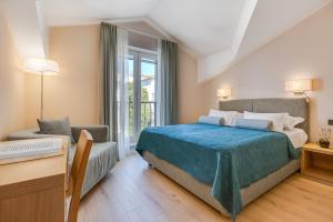 Postel nebo postele na pokoji v ubytování Residence Bepi Malugio