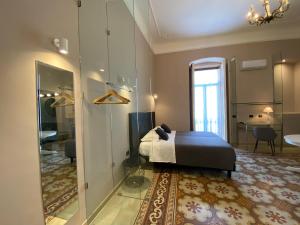 Residenze Romano Ristorante & Spa - albergo diffuso - RED客房内的一张或多张床位