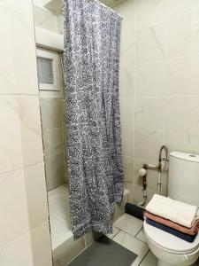 Ένα μπάνιο στο 702 Studio cosy à proximité de Paris 20ème