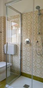 a bathroom with a shower and a toilet and a sink at La Turr de Mezz- Bellagio LCA in Bellagio +119 photos