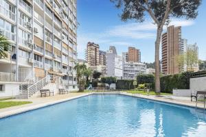 a swimming pool in the middle of a building at Albatros Deluxe 15-5 Apartment Levante Beach in Benidorm