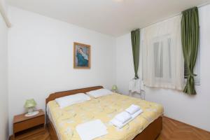 Posteľ alebo postele v izbe v ubytovaní Apartments Tina