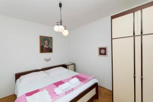 Posteľ alebo postele v izbe v ubytovaní Apartments Tina