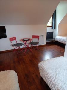 Ein Bett oder Betten in einem Zimmer der Unterkunft chambres et gites d'étretat