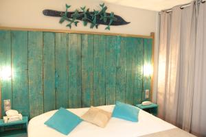 Postel nebo postele na pokoji v ubytování Hotel Les Grenadines
