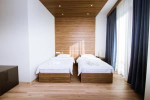 Postel nebo postele na pokoji v ubytování Victoria Inn Tbilisi