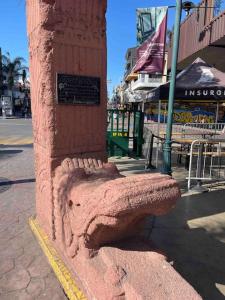 a brick column on the side of a city street at Otay Studio great patio near Otay Crossing & Airport in Tijuana