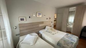 A bed or beds in a room at Malagueta Playa Azul Mediterraneo
