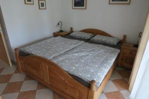 Кровать или кровати в номере Erdgeschosswohnung Gerbera im Haus Isabella