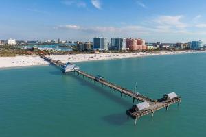 an aerial view of a pier on a beach at Wyndham Grand Clearwater Beach in Clearwater Beach