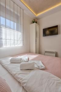 Katil atau katil-katil dalam bilik di Apartman Tajena