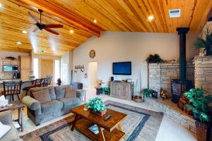 a living room with a couch and a fireplace at Murray Lake Retreat in Bass Lake
