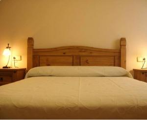 En eller flere senge i et værelse på Casa Rural Betania