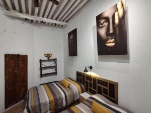 Un pat sau paturi într-o cameră la Terrazas de la Alameda - Panoramic Aparthotel by Lunian