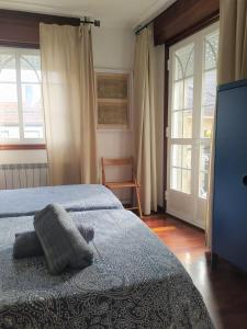 מיטה או מיטות בחדר ב-A Casa da Herba