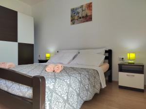 Postel nebo postele na pokoji v ubytování Apartman Memories