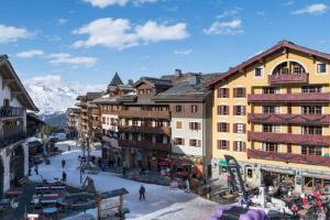 a group of buildings in a town with snow at Arcs 1950 Appartement prestige Ski InOut 6 pax in Bourg-Saint-Maurice
