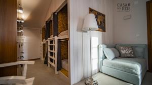 a living room with a blue chair and a lamp at Casa Dos Reis - Boutique Hostel in Angra do Heroísmo