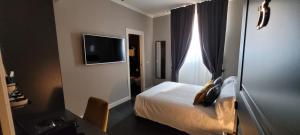 Televízia a/alebo spoločenská miestnosť v ubytovaní Santarella Guest House