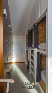 a room with several bunk beds in a room at Casa Dos Reis - Boutique Hostel in Angra do Heroísmo