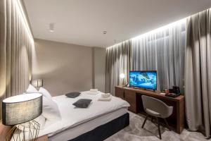 Postel nebo postele na pokoji v ubytování Hotel Turist
