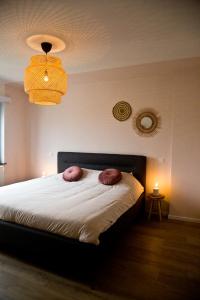 מיטה או מיטות בחדר ב-Vakantiewoning Spoor 23