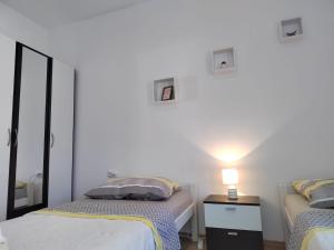 Postel nebo postele na pokoji v ubytování Apartman Memories