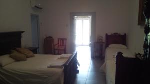 Postel nebo postele na pokoji v ubytování Villa Ida in Bari