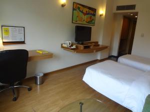 Katil atau katil-katil dalam bilik di Lemon Tree Hotel, Ahmedabad