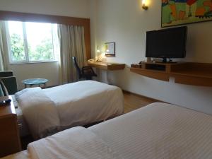 Katil atau katil-katil dalam bilik di Lemon Tree Hotel, Ahmedabad