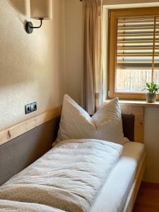 Letto o letti in una camera di Chalet Tuxer