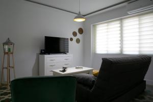 Televízia a/alebo spoločenská miestnosť v ubytovaní Apartamento en el centro de Úbeda - Plaza Andalucía