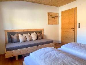 Letto o letti in una camera di Chalet Tuxer
