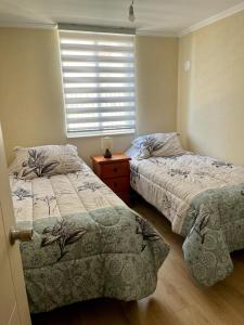 Cama o camas de una habitación en Condominio Parque al Volcán