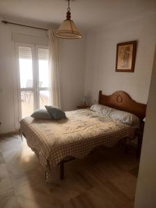 Postel nebo postele na pokoji v ubytování Apartamento Conileño con Terraza