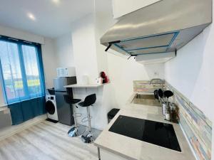 Virtuvė arba virtuvėlė apgyvendinimo įstaigoje Appartement Nid Douillet Plus