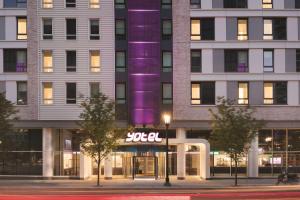 a building with a lit up sign in front of it at YOTEL Boston in Boston