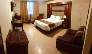 Postel nebo postele na pokoji v ubytování Hotel Oro Inn